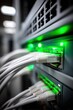 © Generative AI - Close-up of network cables plugged into a server rack with glowing green status lights