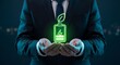© picart studio - Businessman holding green eco-friendly battery icon