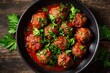 © Azzahrah - Hearty meatballs simmered in rich tomato sauce, garnished with fresh parsley (1)