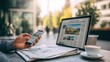 © Dao - Watching news online on laptop with mobile newspaper technology