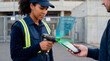 © Rendara Studio - Professional security staff verifying digital ticket with scanner