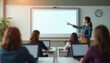 © Evgenia - Blurred background with interactive panel mockup in a classroom environment with a teacher presenting to students in the background. Ideal for education technology presentation and e-learning branding