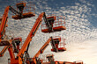 © Fahroni - Articulated boom lift. Aerial platform lift. Telescopic boom lift against blue sky. Mobile construction crane for rent and sale. Maintenance and repair hydraulic boom lift service. Crane dealership.