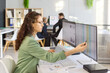 © Studio Romantic - Analyst woman at computer reviewing budget data. She compares spreadsheet columns on dual screens. Accounting control enables timely reporting. Accuracy and productivity office concept.