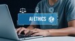 © MdNazim - Person typing on laptop with A I ethics overlay and