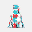 © Samsul - Teamwork building puzzle tower, collaboration, strategy, success, connection, people working together