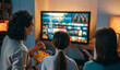 © Konstantin Yuganov - Family Enjoys Cozy Movie Night at Home Streaming Films Together