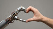 © Anthichada - A robot and a human hand form a heart, blending tech and emotion