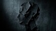 © Svitlana - A solitary human head silhouette made entirely from torn black paper scraps against a dark textured background, jagged edges conveying inner despair and psychological fragility, concept of depression