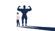 © Lima - Small man standing next to his own giant and highly muscular shadow, symbolizing immense inner strength and hidden potential.