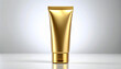 © alya - Blank gold metallic cosmetic tube mockup standing on clean white background