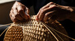© MadeOka - Weaving Hands Crafting Intricate Natural Bamboo Basketry in Close Up Detail