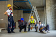 © Mediteraneo - Exhausted Construction Team Dealing with Occupational Stress on Site