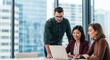 © Genowefa - Group of business people partners having conversation discussion using laptop sitting in office desk. Woman manager showing finance project online, doing training to colleagues. Web banner, copy space