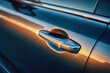 © Mikhail Vorobev - Metallic car door handle reflecting golden sunlight on sleek vehicle surface highlighting modern automotive design and smooth contours at dusk
