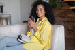 © zinkevych - Young woman having coffee at home and feeling peaceful and comfortable
