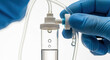 © Ajronujen - Medical professional adjusting intravenous drip in hospital setting