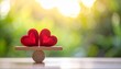 © Muhammad - Two red hearts on seesaw, balance, harmony, love symbolism