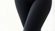 © Jhon - blackish. Black sports legging stretched tight, showing fabric texture and elasticity. lifestyle magazines, social media lookbooks, designed for lifestyle magazines and social media content.