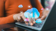 © Thawatchai Images - Cloud computing data storage concept.Digital transformation for small business.Secure online database management system.Businesswoman working on laptop with cloud icons.