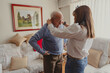 © Luis - Daughter helping senior father dressing at home