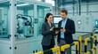 © spyrakot - Female quality manager and male business analyst in modern factory