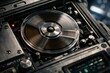 © Татьяна Евдокимова - Magnetic tape reel spinning rapidly inside an old fashioned sound recording device, highlighting the intricate mechanical components and the process of analog data playback
