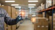 © Batoor - Person using digital checklist interface to verify inventory and quality control in a warehouse setting.