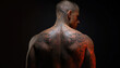 © V Art - Intricate tattoo designs showcase artistry on the back of a muscular man in low light with vibrant highlights enhancing the details
