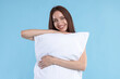 © New Africa - Beautiful woman with pillow on light blue background