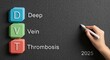 © The Little Hut - Deep Vein Thrombosis medical abbreviation DVT explained on blackboard with a hand writing 2025