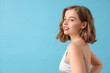 © Pixel-Shot - Beautiful young woman with bob hairstyle on blue background