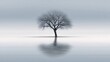 © buraratn - Solitary tree in calm waters with reflections and misty background, evoking a sense of solitude and tranquility in a minimalist landscape setting