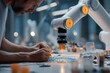 © witsarut - Close-up of Sustainable Footwear Artisan Hands Collaborating with Precision Robotic Arm and AI on Eco-Friendly Materials.