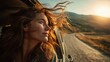 © pisan thailand - A woman enjoys the warm breeze and golden sunlight while leaning out of a car window on a scenic, winding road during sunset.