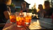 © decorator - Warm evening cocktails shared among friends a relaxed summer moment captured outdoors