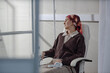 © Westend61 - Patient receiving chemotherapy treatment in clinic room wearing headscarf