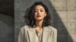© NovaVision - This gorgeous woman's portrait showcases a blend of elegance and modern fashion against a textured backdrop.