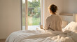 © praewpailyn - Woman bedroom morning sunlight window bed coffee relaxation mental health morning wellness lifestyle scene with woman sitting bed by window holding coffee soft sunlight calm home interior with