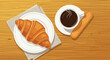 © Rezvi - High angle view of a delicious breakfast with a steaming cup of black coffee a buttery croissant on a plate and a long biscuit on wood.