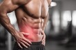 © whitestorm - Muscular man with abdominal pain, highlighting the red area of discomfort in his side.