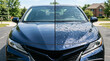 © akridiy - Comparison of clean car hood and severe hail damage dents