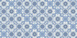 © Danchenko - Blue and white azulejo tile pattern with ornate floral and geometric motifs. Traditional Portuguese ceramic mosaic background inspired by vintage decorative wall tiles and classic Mediterranean style.