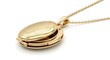 © Fick - A gold locket hangs from a chain on a white background with jewelry and accessories
