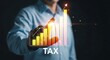 © Irfan - A businessman analyzing a tax graph with an increasing trend