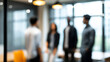 © Curioso.Photography - Blurred business meeting scene with professionals discussing in modern office environment
