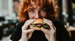 © maxbarbosac - Young caucasian man with red hair enjoying turkish kebab sandwich in casual restaurant with warm tones and blurred background Concept of street food pleasure