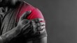 © Viktoriia - Person experiencing pain in the shoulder while holding the affected area in a dim setting