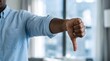 © Freelancer Rakib - A man giving a thumbs down in an office setting with a blurred background
