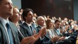 © hsantima - Audience applauding at a corporate event.